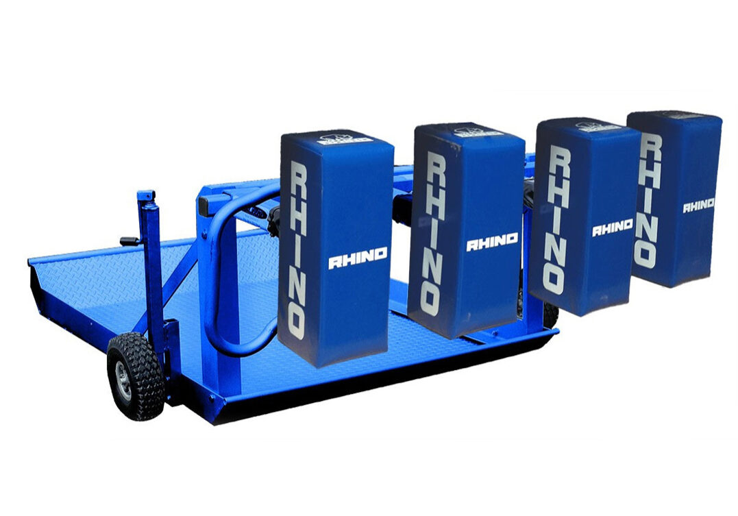 A blue cart with four large boxes on it.