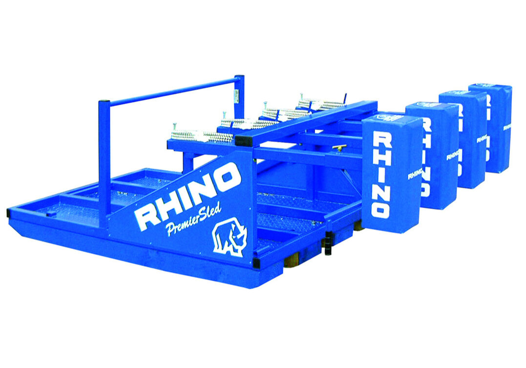 A blue rhino cart with multiple carts on top of it.
