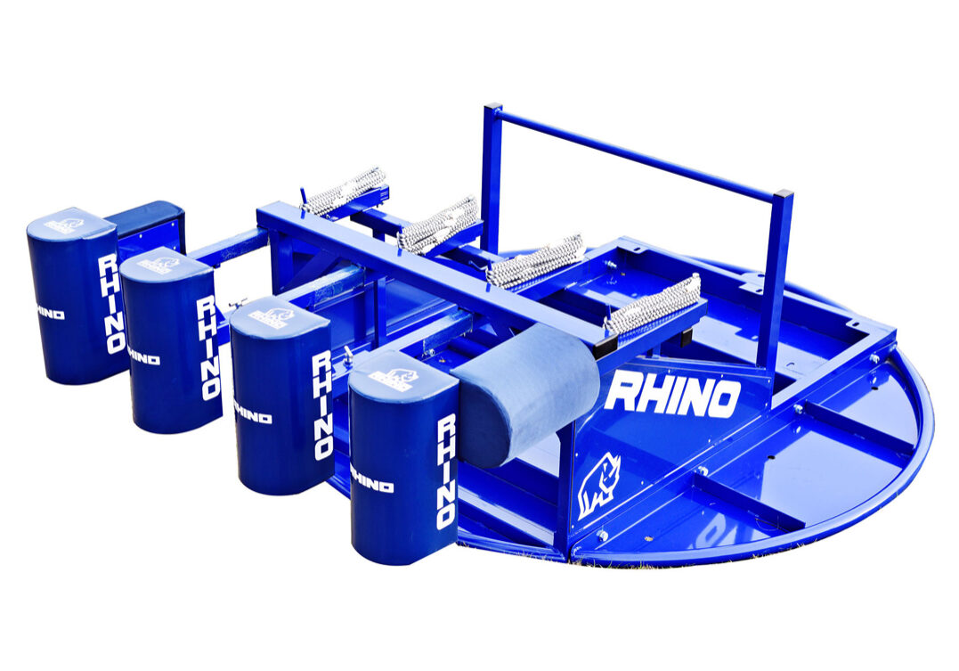 A blue rhino game with many cans on top of it.